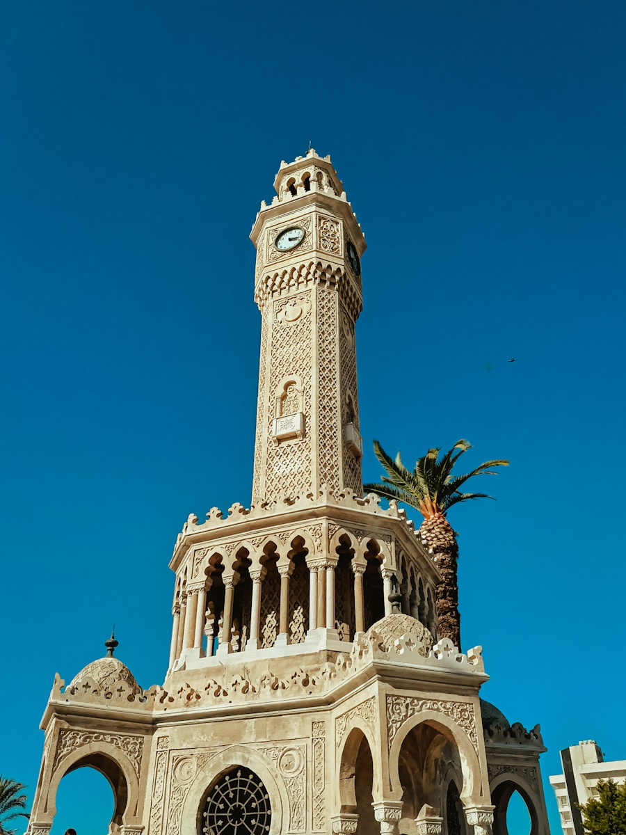 A tall tower with a clock on the top of it
